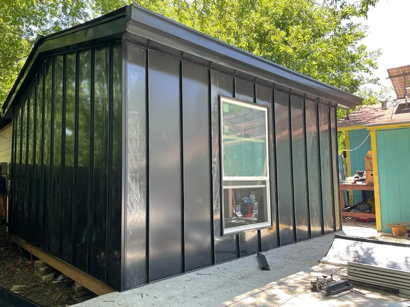 Black standing seam metal wall panels for Roof Inspection in Rapid Valley