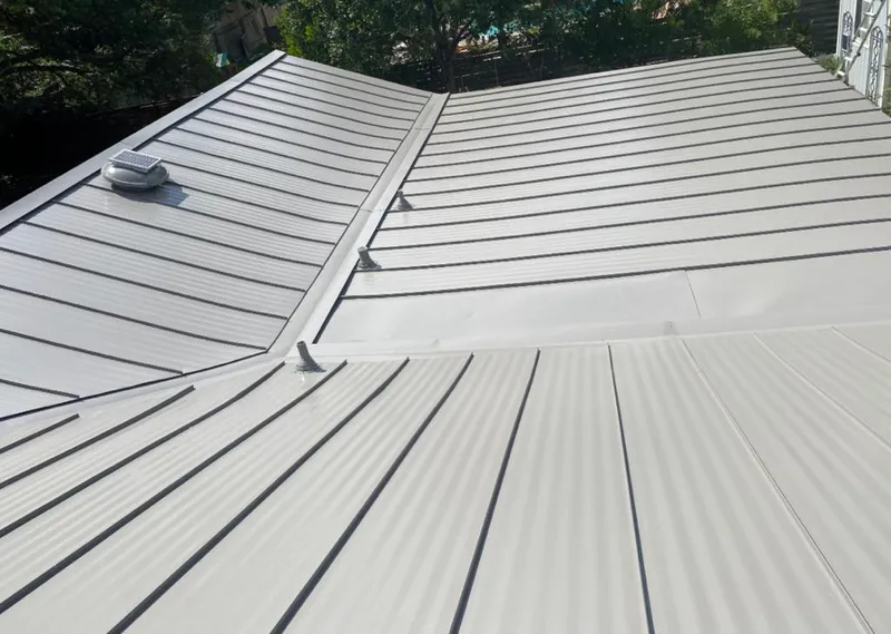 Solar attic fan installed on a metal roof for Roof Ventilation in Rapid Valley